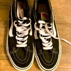 Black and white vans high tops.